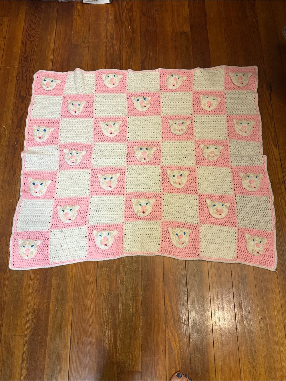Cozy Pink and White Crochet Baby Blanket with Animal Motifs